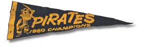 A vintage black pennant features yellow text reading “PIRATES 1960 CHAMPIONS” and a cartoon pirate with a sword illustrated on it. *AI generated alt text