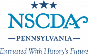 Logo for the NSCDA Pennsylvania, as seen at Fort Pitt, featuring three stars above the acronym and the text Entrusted With History’s Future. *AI generated alt text